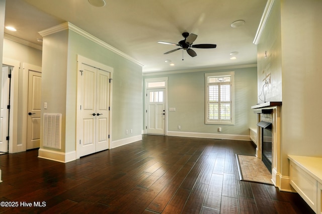 6445 Figure Eight Dr SW, Ocean Isle Beach, NC 28469 - entryway featuring a fireplace with flush hearth, ceiling fan, dark wood finished floors, ornamental molding, and recessed lighting