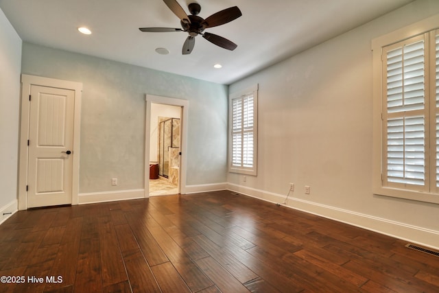 6445 Figure Eight Dr SW, Ocean Isle Beach, NC 28469 - unfurnished bedroom featuring hardwood / wood-style flooring, baseboards, recessed lighting, ensuite bath, and ceiling fan
