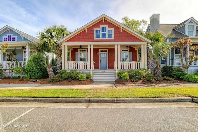 6445 Figure Eight Dr SW, Ocean Isle Beach, NC 28469 - view of front of home with a porch and ceiling fan