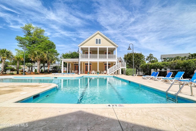 6445 Figure Eight Dr SW, Ocean Isle Beach, NC 28469 - community pool featuring stairway, fence, and a patio