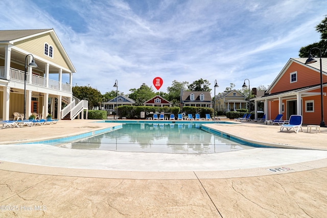 6445 Figure Eight Dr SW, Ocean Isle Beach, NC 28469 - community pool with a patio and stairway