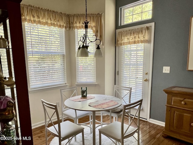 7473 Balmore Dr SW, Sunset Beach, NC 28468 - dining space with wood finished floors and baseboards