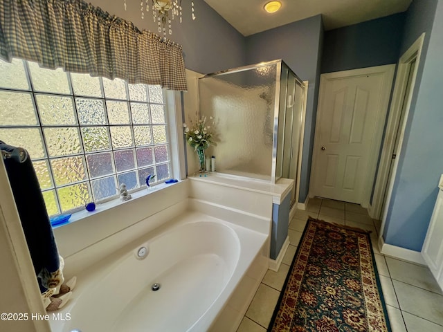 7473 Balmore Dr SW, Sunset Beach, NC 28468 - full bath featuring tile patterned flooring, a stall shower, a bath, and baseboards