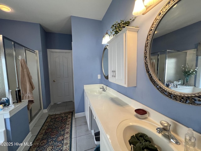 7473 Balmore Dr SW, Sunset Beach, NC 28468 - bathroom featuring a stall shower, double vanity, and tile patterned flooring