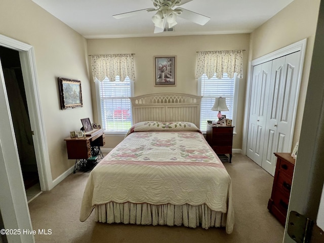 7473 Balmore Dr SW, Sunset Beach, NC 28468 - carpeted bedroom with a closet, baseboards, and a ceiling fan