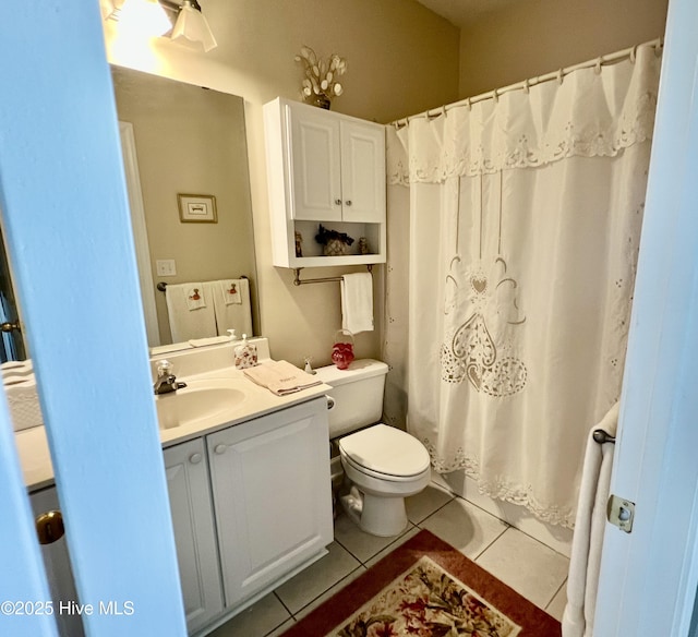 7473 Balmore Dr SW, Sunset Beach, NC 28468 - full bathroom with tile patterned flooring, vanity, toilet, and a shower with shower curtain