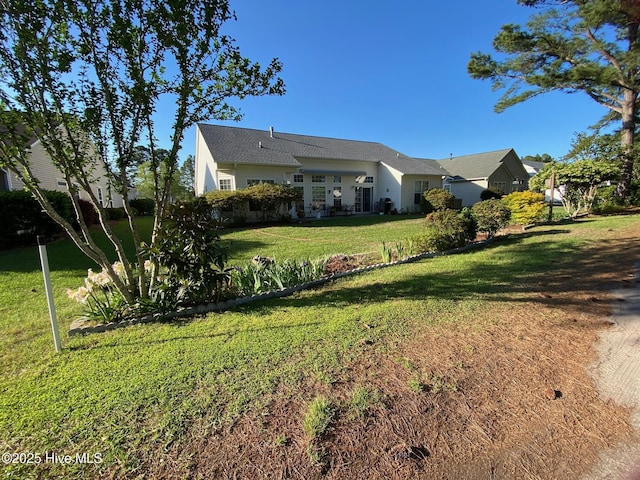 7473 Balmore Dr SW, Sunset Beach, NC 28468 - view of front of house with a front lawn
