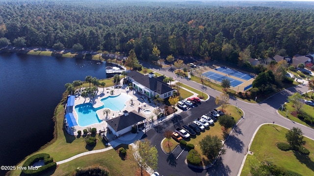 7473 Balmore Dr SW, Sunset Beach, NC 28468 - aerial overview of property's location with a forest, a pool, and a large body of water