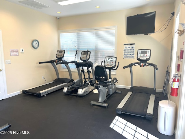 7473 Balmore Dr SW, Sunset Beach, NC 28468 - exercise room featuring baseboards and recessed lighting