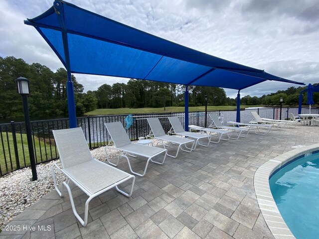 7473 Balmore Dr SW, Sunset Beach, NC 28468 - community pool with a patio area