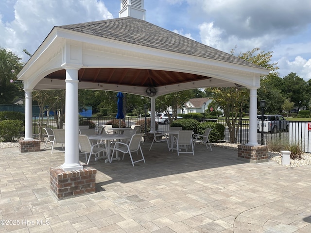 7473 Balmore Dr SW, Sunset Beach, NC 28468 - view of patio featuring a gazebo and outdoor dining area