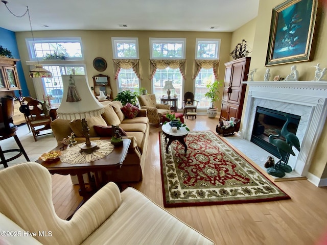 7473 Balmore Dr SW, Sunset Beach, NC 28468 - living area with healthy amount of natural light and light wood finished floors
