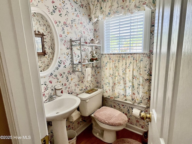7473 Balmore Dr SW, Sunset Beach, NC 28468 - bathroom featuring wallpapered walls, baseboards, and toilet