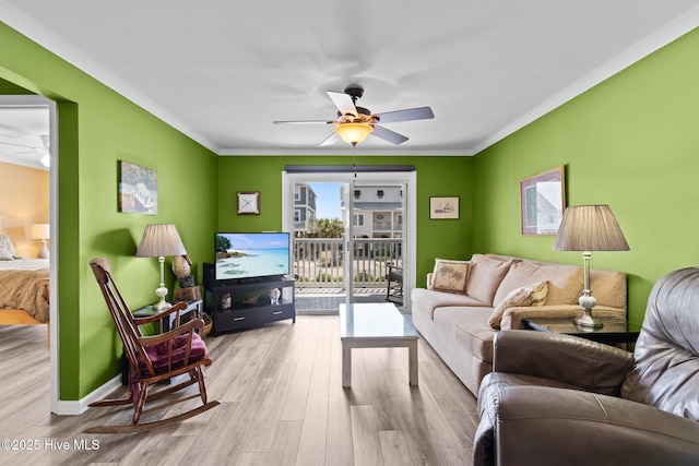 2714 W Beach Dr # 104, Oak Island, NC 28465 - living room featuring crown molding, wood finished floors, a ceiling fan, and baseboards