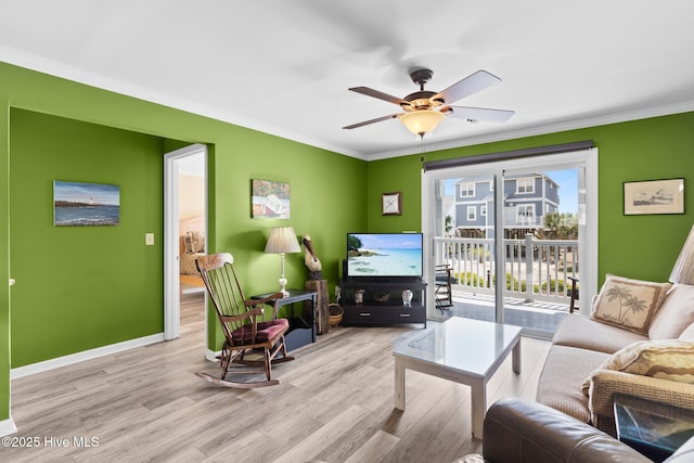 2714 W Beach Dr # 104, Oak Island, NC 28465 - living room with a ceiling fan, baseboards, ornamental molding, and wood finished floors