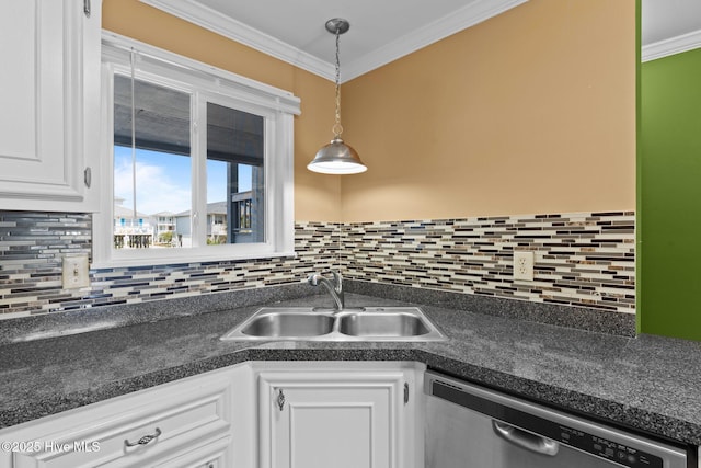 2714 W Beach Dr # 104, Oak Island, NC 28465 - kitchen with dark countertops, stainless steel dishwasher, white cabinetry, and a sink