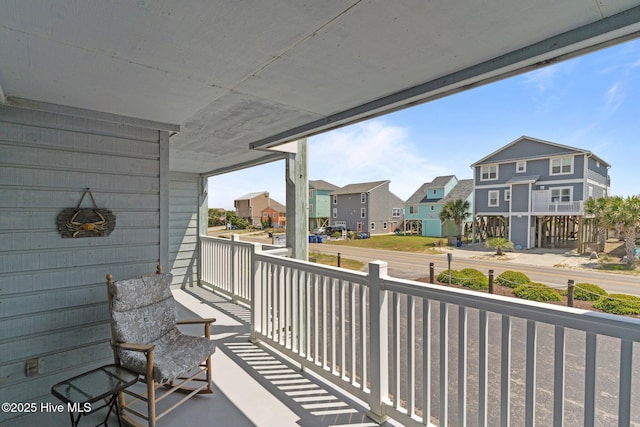 2714 W Beach Dr # 104, Oak Island, NC 28465 - balcony with covered porch and a residential view