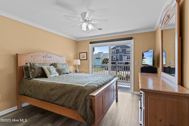 2714 W Beach Dr # 104, Oak Island, NC 28465 - bedroom featuring crown molding, access to exterior, light wood finished floors, and baseboards