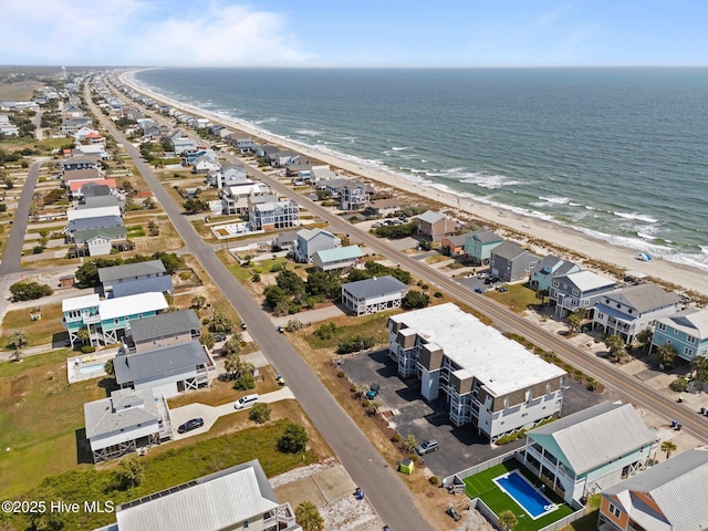 2714 W Beach Dr # 104, Oak Island, NC 28465 - drone / aerial view with a view of the beach and a water view