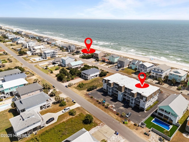 2714 W Beach Dr # 104, Oak Island, NC 28465 - drone / aerial view with a view of the beach and a water view