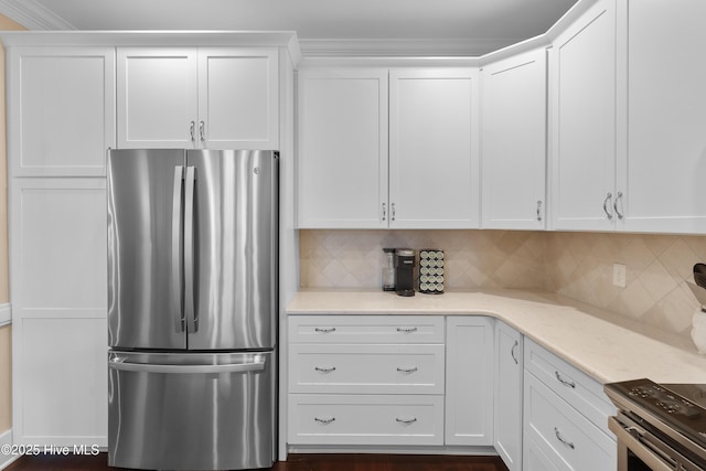 2537 St James Dr SE Apt 1003, Southport, NC 28461 - kitchen featuring white cabinets, tasteful backsplash, light stone countertops, and appliances with stainless steel finishes