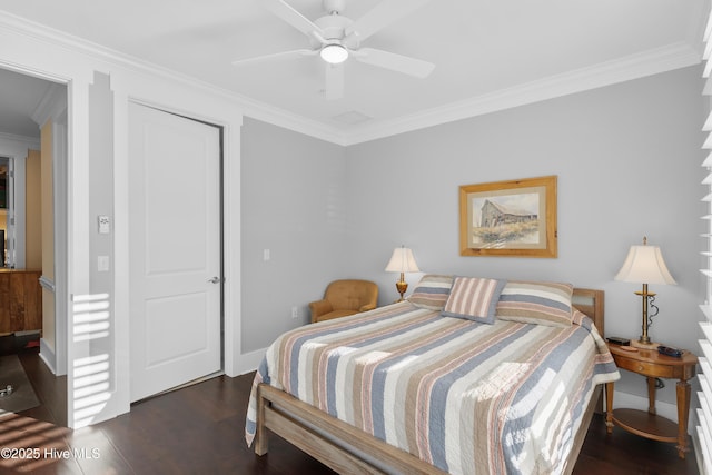 2537 St James Dr SE Apt 1003, Southport, NC 28461 - bedroom featuring wood finished floors, a closet, baseboards, and ornamental molding