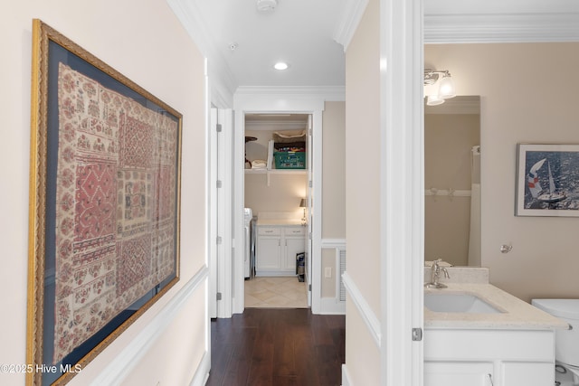 2537 St James Dr SE Apt 1003, Southport, NC 28461 - hall featuring recessed lighting, visible vents, ornamental molding, a sink, and dark wood-type flooring
