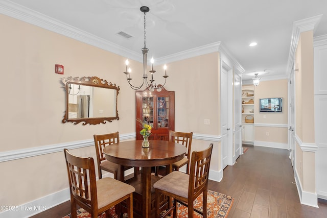 2537 St James Dr SE Apt 1003, Southport, NC 28461 - dining room featuring baseboards, visible vents, a notable chandelier, crown molding, and dark wood-type flooring