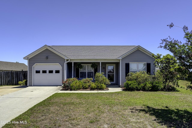 single story home featuring a front lawn, fence, a shingled roof, concrete driveway, and an attached garage