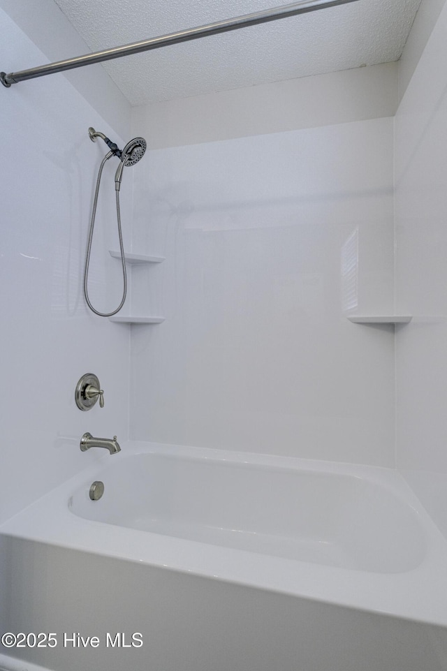 bathroom featuring washtub / shower combination