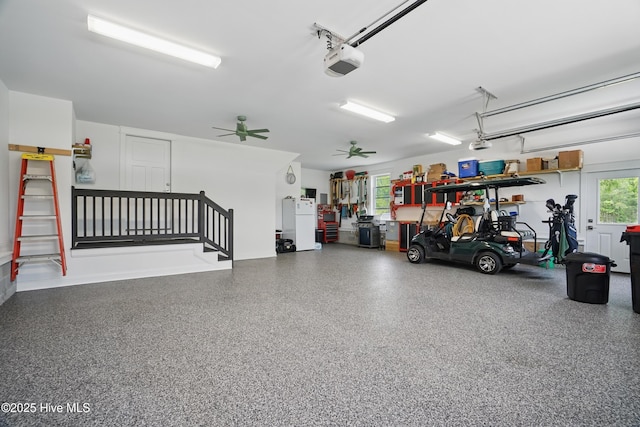 garage featuring a ceiling fan and a garage door opener