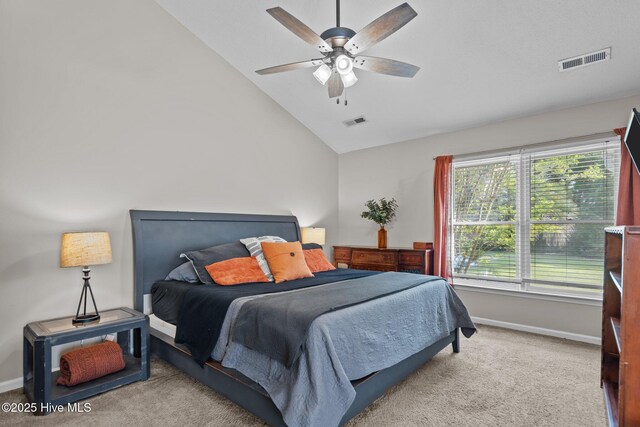 bedroom with baseboards, light colored carpet, and visible vents