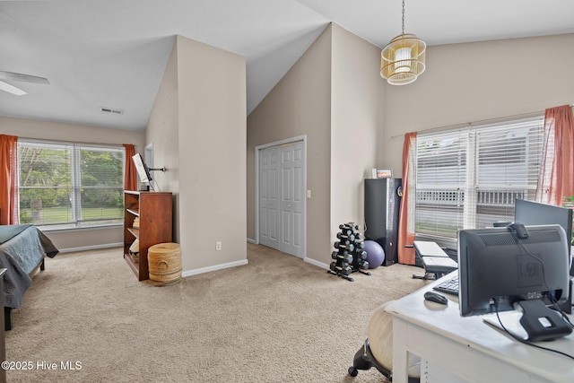 carpeted office featuring baseboards, a ceiling fan, visible vents, and high vaulted ceiling
