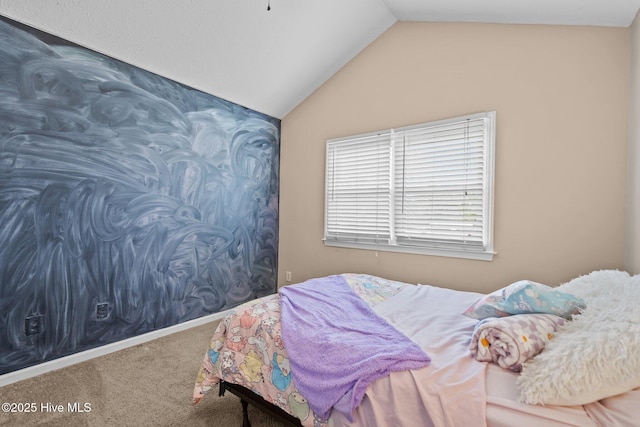 carpeted bedroom featuring lofted ceiling