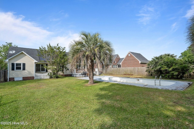 view of yard featuring a fenced in pool and a fenced backyard