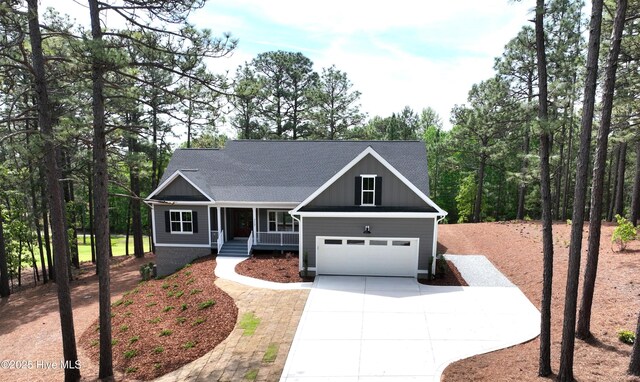 117 Banbridge Dr, West End, NC 27376 - craftsman-style home featuring concrete driveway, board and batten siding, and covered porch