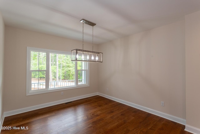 117 Banbridge Dr, West End, NC 27376 - unfurnished dining area with baseboards and dark wood finished floors