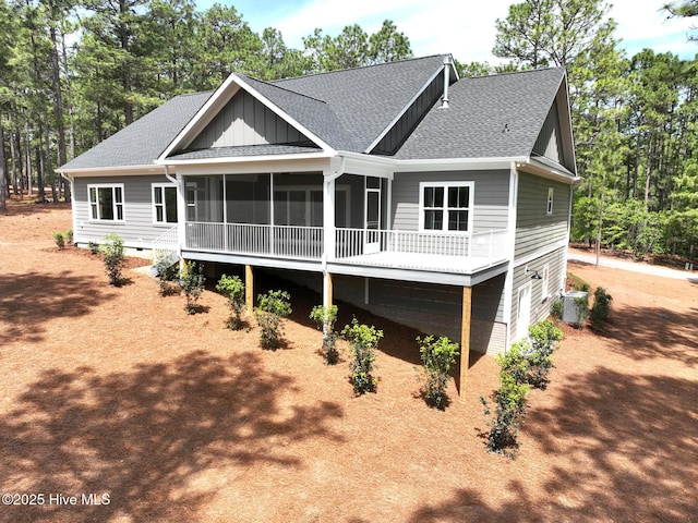 117 Banbridge Dr, West End, NC 27376 - back of house featuring a sunroom, roof with shingles, and central air condition unit