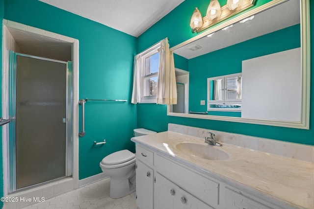 full bath featuring vanity, toilet, tile patterned flooring, and a stall shower