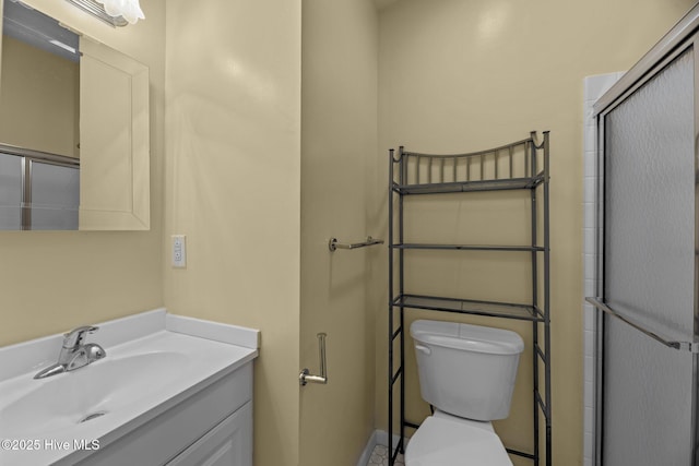 full bathroom featuring vanity and toilet