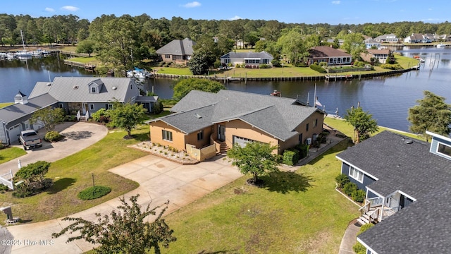 birds eye view of property featuring a water view and a residential view