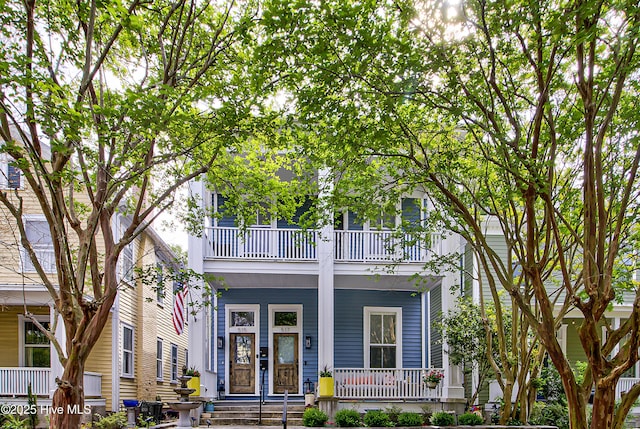 view of front of home featuring a balcony and a porch