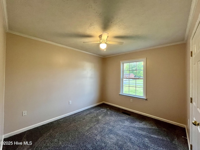 spare room featuring dark carpet, a ceiling fan, baseboards, and ornamental molding