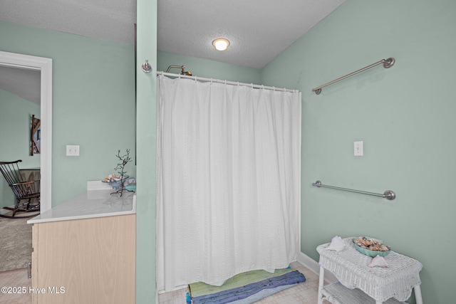 105 Island Quay Ct, Atlantic Beach, NC 28512 - full bath with a textured ceiling, baseboards, and curtained shower