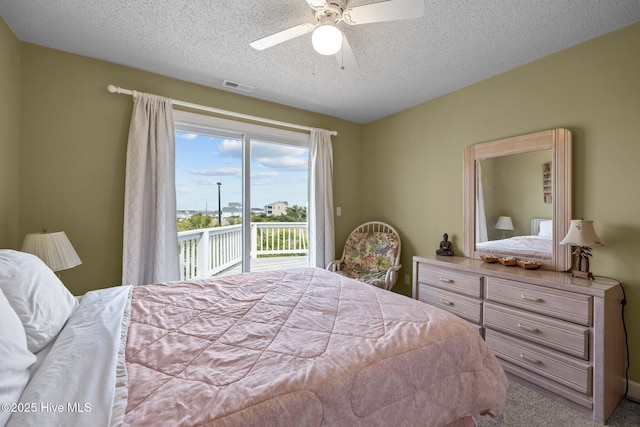 105 Island Quay Ct, Atlantic Beach, NC 28512 - carpeted bedroom with a ceiling fan, a textured ceiling, visible vents, and access to exterior