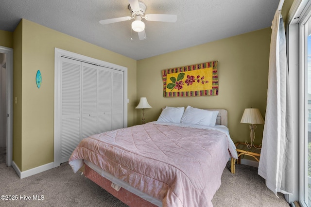 105 Island Quay Ct, Atlantic Beach, NC 28512 - bedroom featuring ceiling fan, a textured ceiling, carpet, baseboards, and a closet
