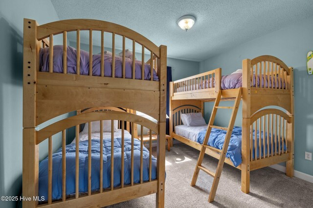 105 Island Quay Ct, Atlantic Beach, NC 28512 - bedroom featuring baseboards, carpet flooring, and a textured ceiling