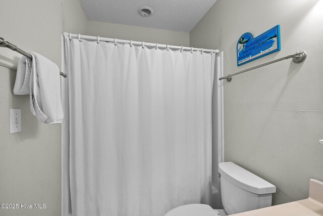 105 Island Quay Ct, Atlantic Beach, NC 28512 - full bath featuring toilet and a textured ceiling