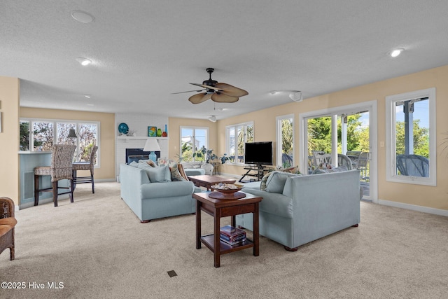 105 Island Quay Ct, Atlantic Beach, NC 28512 - living area featuring a ceiling fan, a healthy amount of sunlight, and light carpet