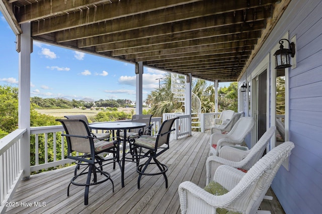 105 Island Quay Ct, Atlantic Beach, NC 28512 - wooden deck featuring stairs and outdoor dining space